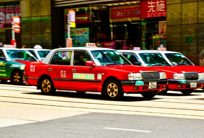 a row of cars parked on the side of a road